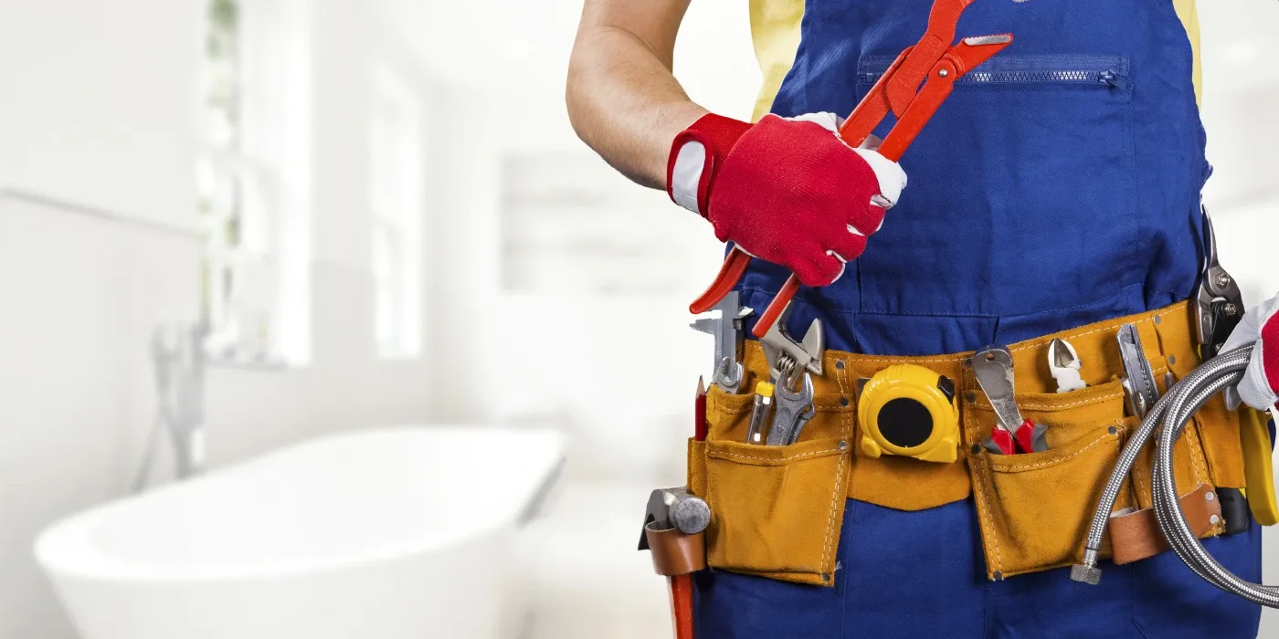 The torso of plumbing technician showing a tool belt from The Leander Plumber - Company in Leander, TX - Faucet replacement The torso of plumbing technician showing a tool belt from The Leander Plumber - Company in Leander, TX - Faucet replacement