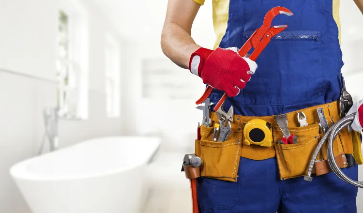 The torso of plumbing technician showing a tool belt from The Leander Plumber - Company in Leander, TX - Faucet replacement